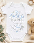 In daddy’s hands